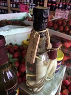 wine bottle on background of strawberries