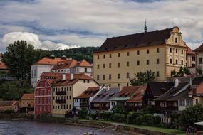 Beautiful and colorful houses in ÄeskÃ½ Krumlov, Czech Republic, on the shore of the river, among the green plants