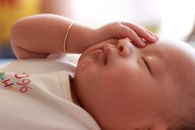 sleeping asian newborn close up