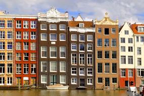 colorful buildings on the canal in Amsterdam