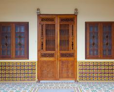 wooden front door on an old decorative facade