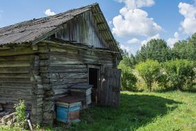 old wooden hut in the countryside on a sunny day