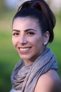 Girl in grey scarf Smiling