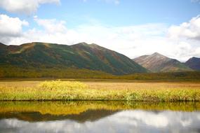 mountains, autumn grass and lake