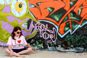 Graffiti wall and girl Sunglasses