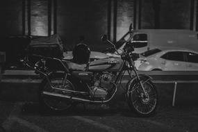 motorcycle on city street in black and white background