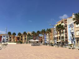 colorful houses among palm trees in Villajoyosa