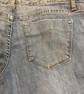 Close-up of the back of the colorful jeans, with the pockets