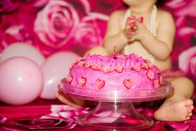 Girl and pink Cake