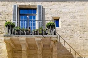 plants grow on balcony of old Stone House, france, provence, villeneuve lez avignon