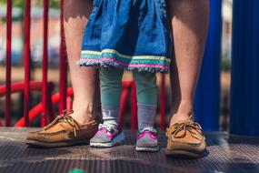 photo of dad and daughter's legs
