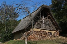 Beautiful house on the green hill among the trees in the old village