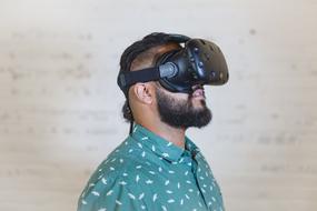 photo of a bearded man in virtual reality glasses