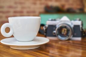 old camera by the mug
