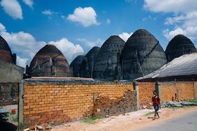 brick ovens behind wall, vietnam