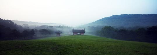 photo of houses in the fog in the countryside in Korea