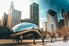 people near the domed building and skyscrapers