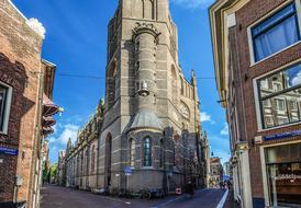 old buildings at street crossroads in amsterdam