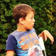 photo of a boy on a chair