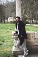 stylish young man in coat