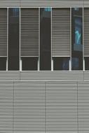 Close-up of the building, with the shiny, blue windows