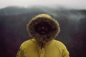 Man in yellow winter jacket