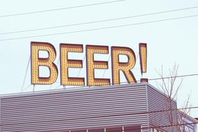 beer sign on the roof of the building