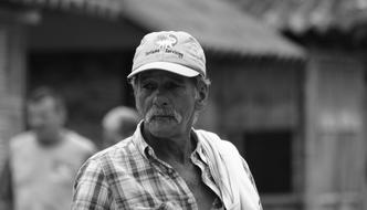 Old man in cap on street, Black And White