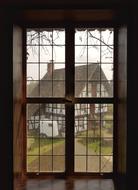 photo of a country house through the window