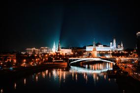 Beautiful city with the bridge with colorful lights at night