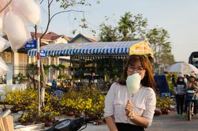 funny Young asian Girl with cotton candy