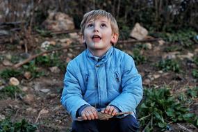 Child in blue jacket