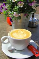 sweet coffee by the flowers