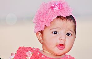 asian Baby Girl in pink headdress