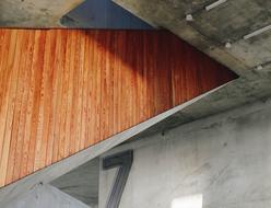 Close-up of the architecture, with the brown wooden wall