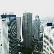 black and white photo of skyscrapers in the city