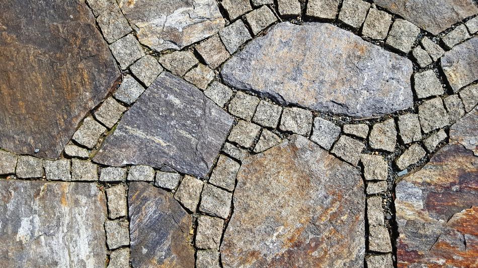 Beautiful and colorful pattern with stones on the ground