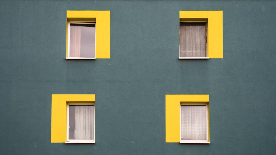 windows with yellow slopes on the house