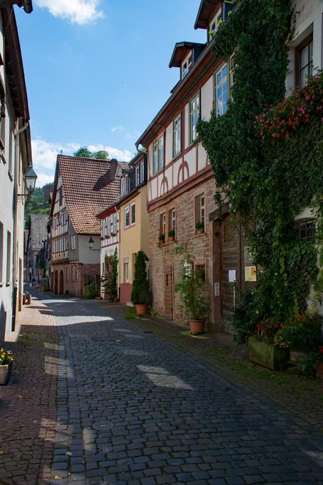 Beautiful and colorful historic center of Miltenburg, Germany, on Odenwald, in sunlight and shadows