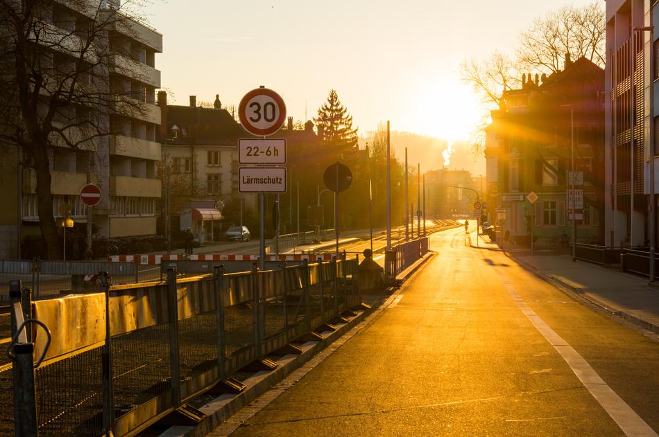 sunlight with houses by the road