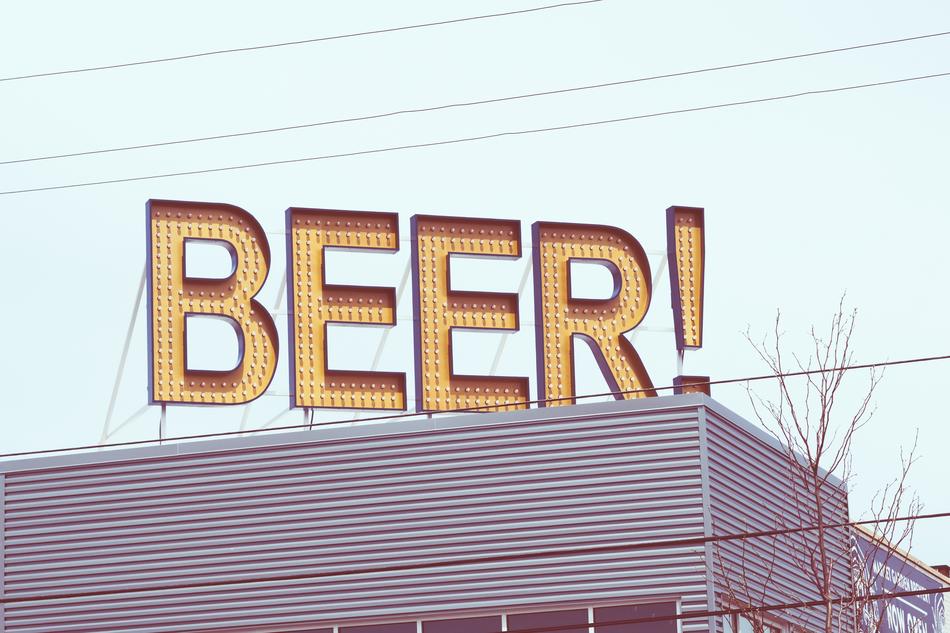 beer sign on the roof of the building