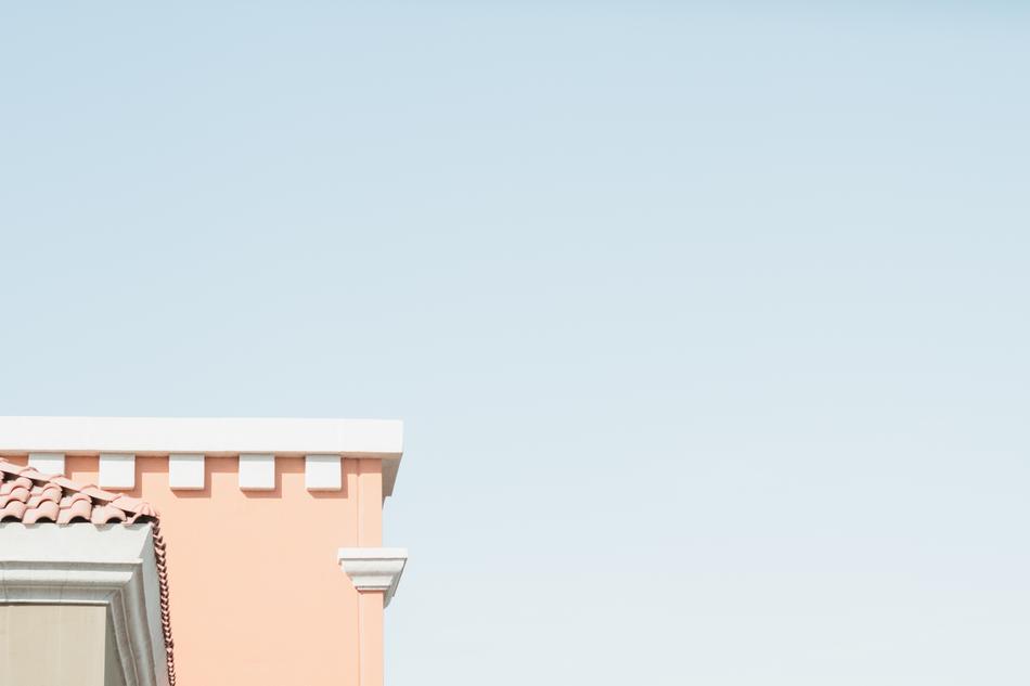 Beautiful and colorful roof corner of the building, at beautiful, blue, gradient sky