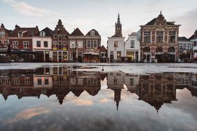 Beautiful and colorful buildings, on the shore, with the reflections