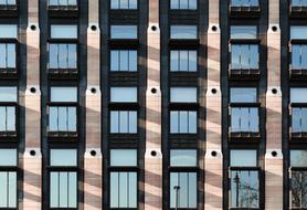 Beautiful beige modern building with windows