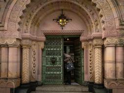 old green door in arched entrance