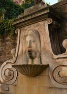 fountain with a man's face