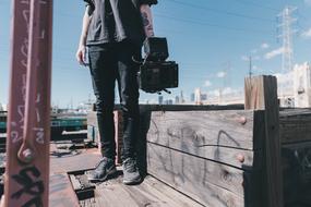 man with a camera in harbor