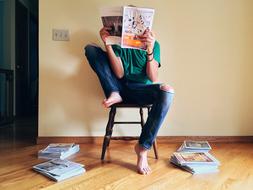 Person Reading Magazine home