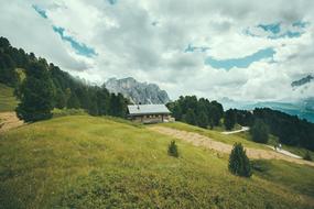grass green house mountain