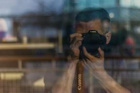 Man photographer window